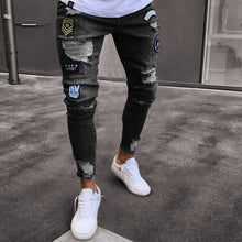 Load image into Gallery viewer, European and American small foot badge jeans men&#39;s fashion knee hole zipper small foot hole denim trousers
