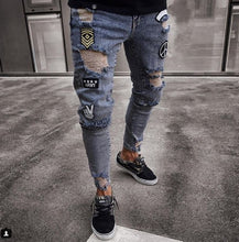 Load image into Gallery viewer, European and American small foot badge jeans men&#39;s fashion knee hole zipper small foot hole denim trousers
